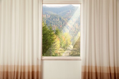 Beautiful view of mountain landscape through window