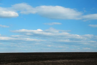 Picturesque view of agricultural field on cloudy day