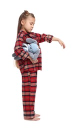 Girl in pajamas with toy bunny sleepwalking on white background