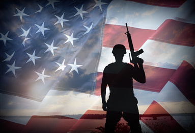 Double exposure with silhouette of soldier and American flag. Military service