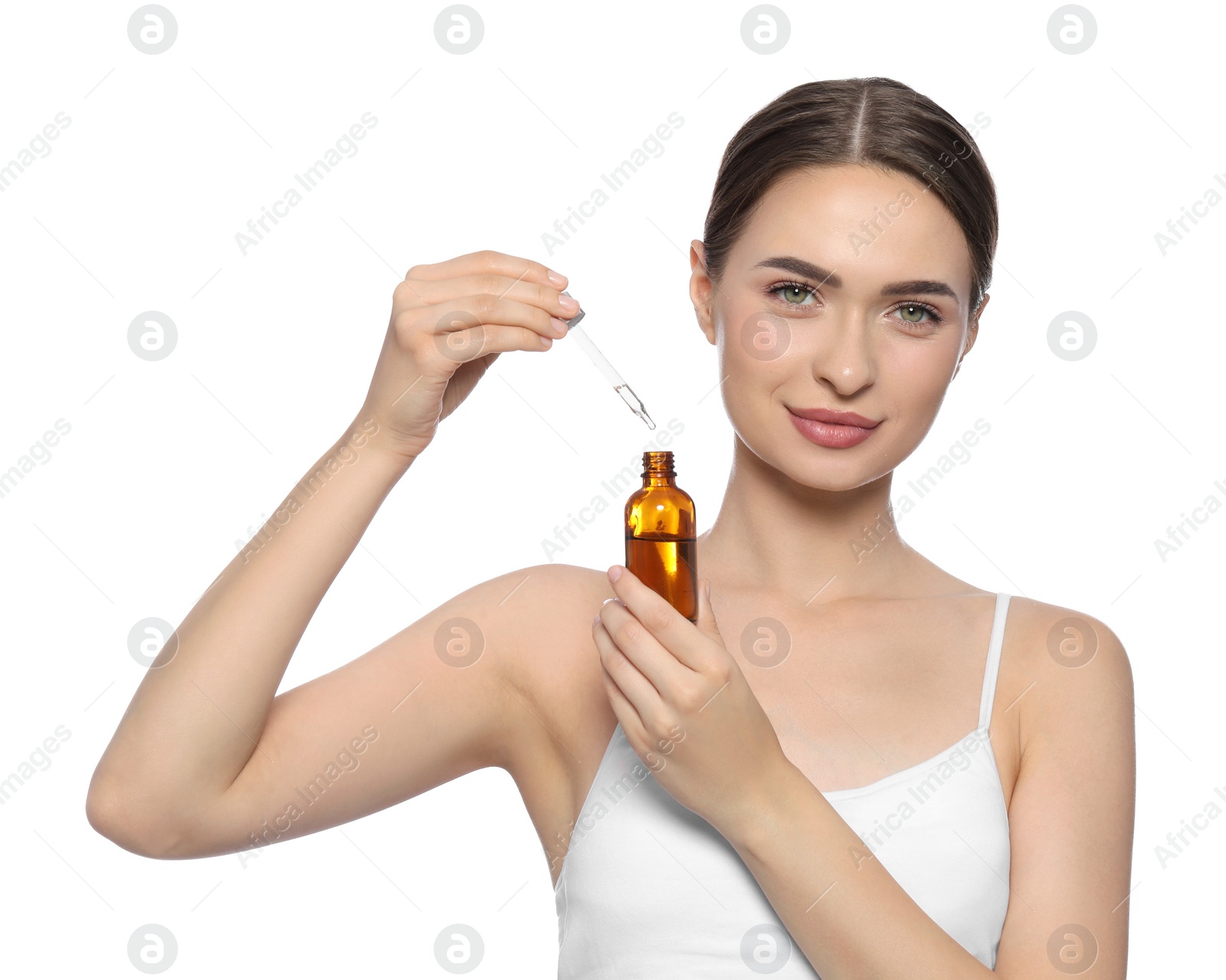 Photo of Young woman with bottle of essential oil on white background