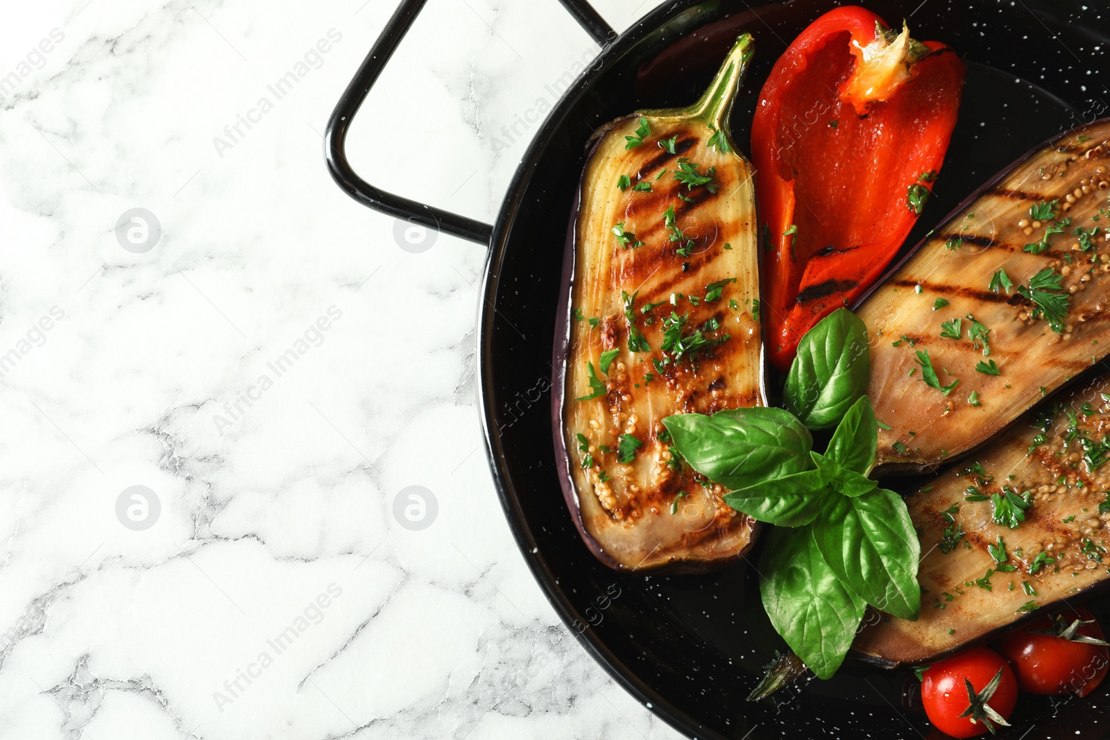 Photo of Grill pan of fried eggplants on marble table, top view with space for text