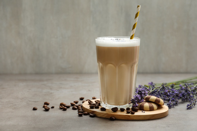 Delicious coffee with lavender and cookies on grey table. Space for text