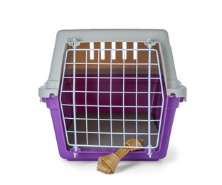 Photo of Violet pet carrier with chewing bone isolated on white