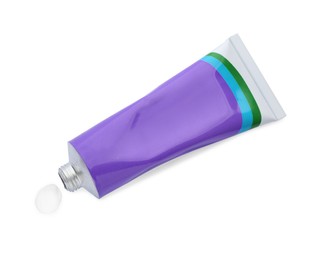 Photo of Open tube with ointment on white background, top view