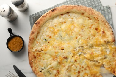 Photo of Delicious cheese pizza served on white marble table, flat lay