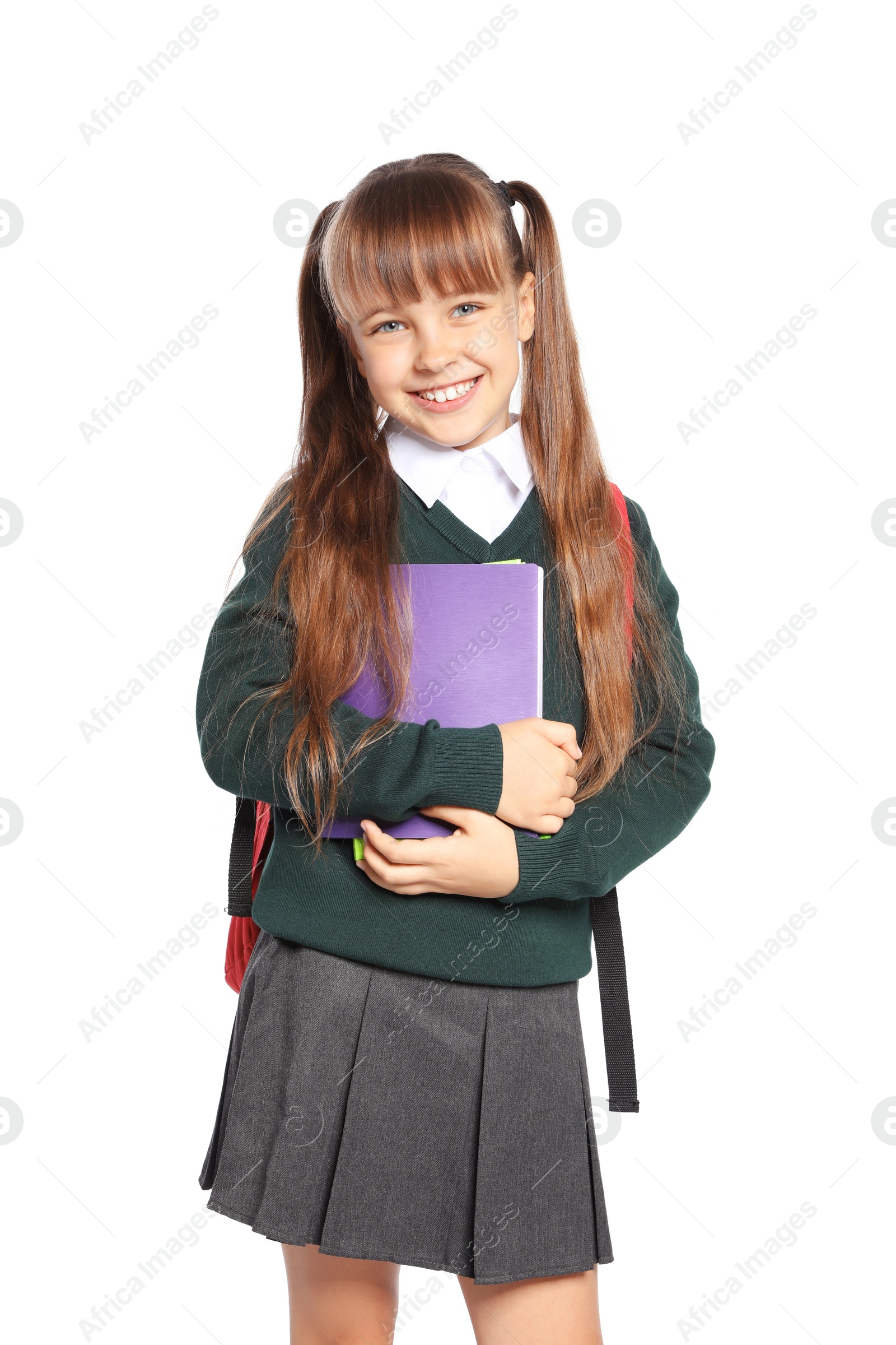 Photo of Little girl in stylish school uniform on white background