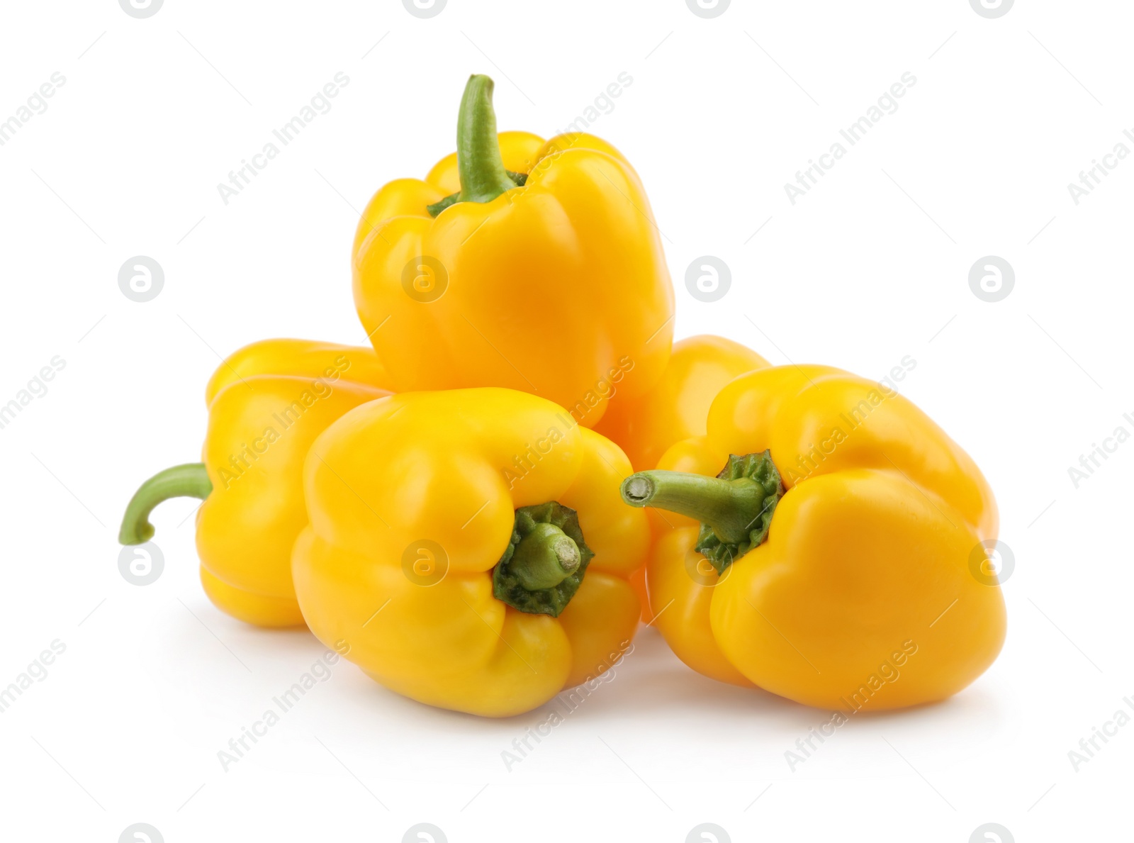 Photo of Ripe yellow bell peppers isolated on white