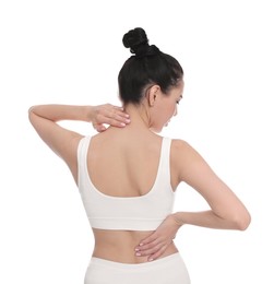 Woman suffering from pain in back on white background