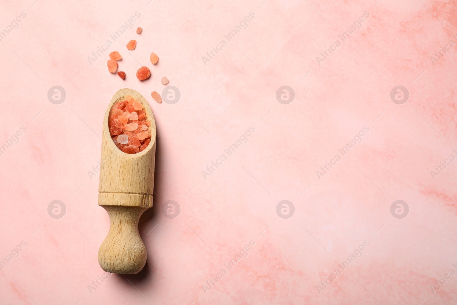 Photo of Aromatic sea salt on pink marble table, flat lay. Space for text