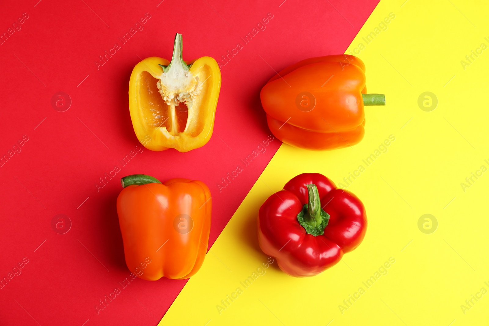 Photo of Flat lay composition with ripe bell peppers on color background