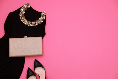 Photo of Evening dress, clutch and shoes on pink background, flat lay with space for text. Clothes rent concept