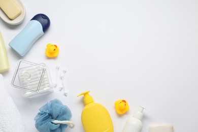 Photo of Baby bath accessories and care products on white background, flat lay. Space for text