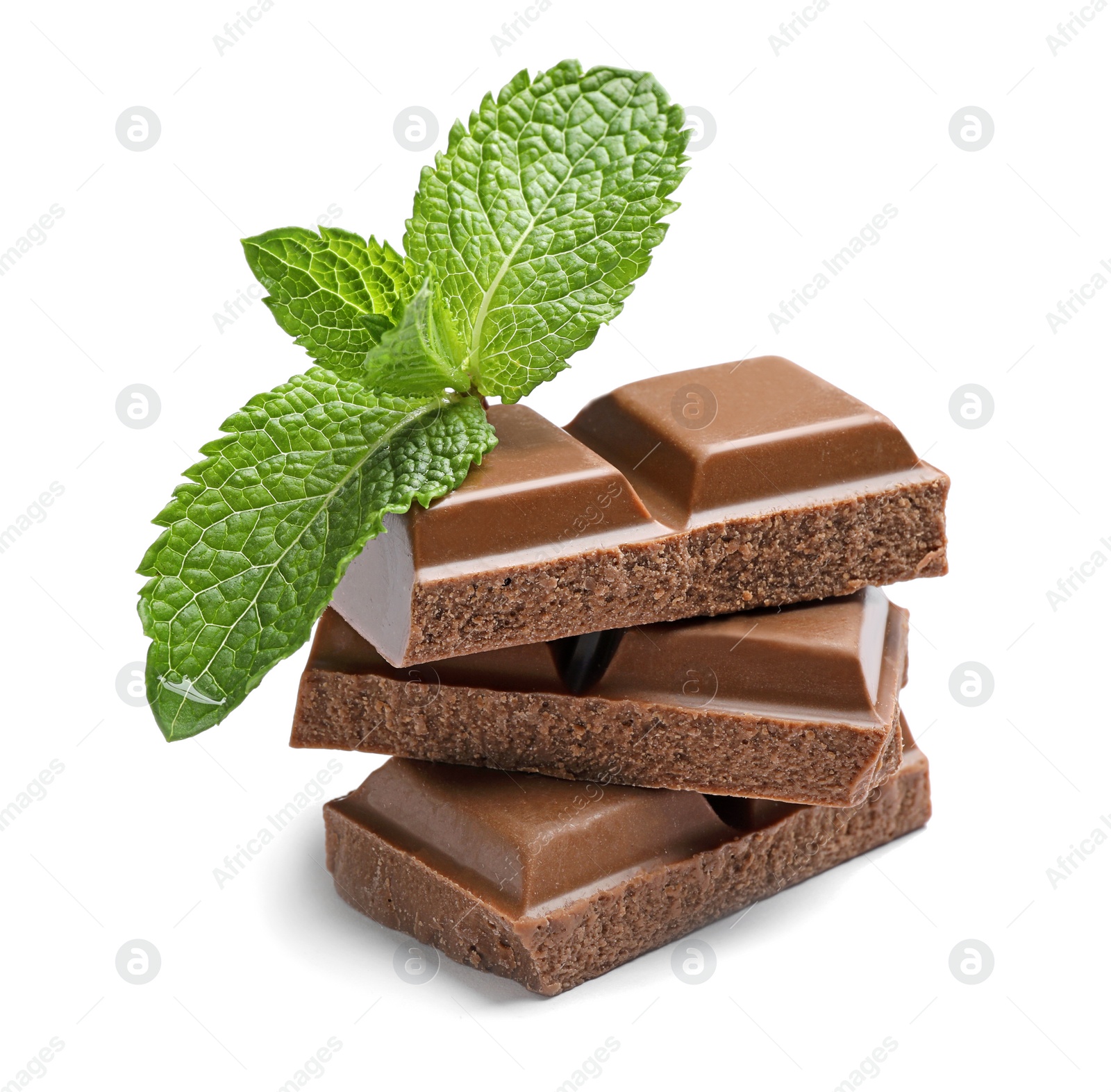 Photo of Pieces of milk chocolate with mint on white background