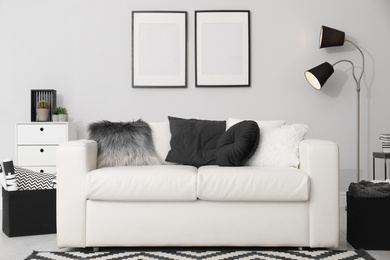 Photo of Elegant white sofa in modern living room interior