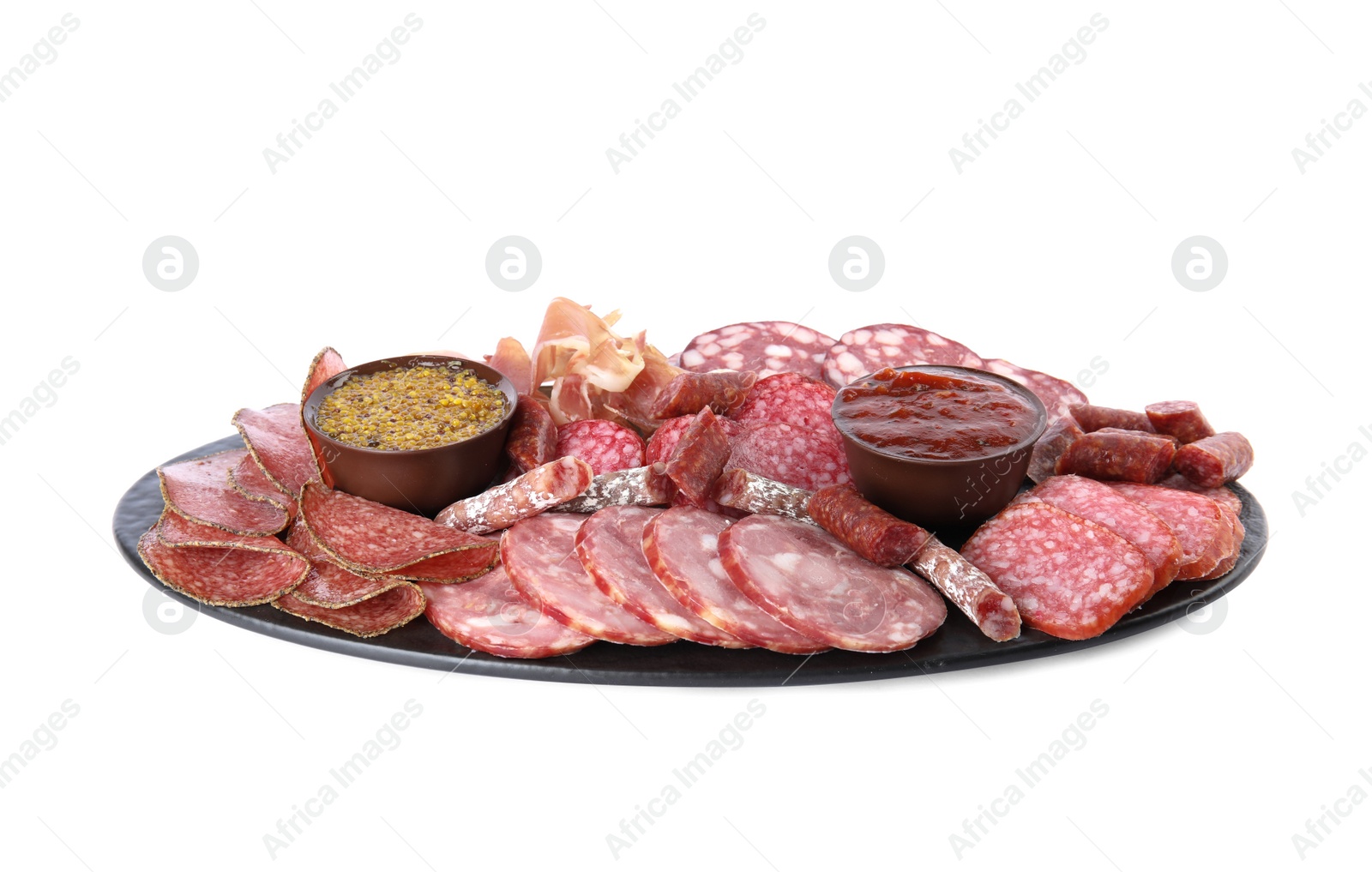 Photo of Slices of different sausages with sauce isolated on white