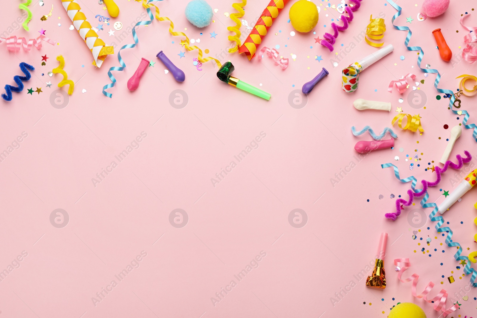 Photo of Flat lay composition with carnival items on pink background. Space for text