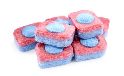 Pile of dishwasher detergent tablets on white background