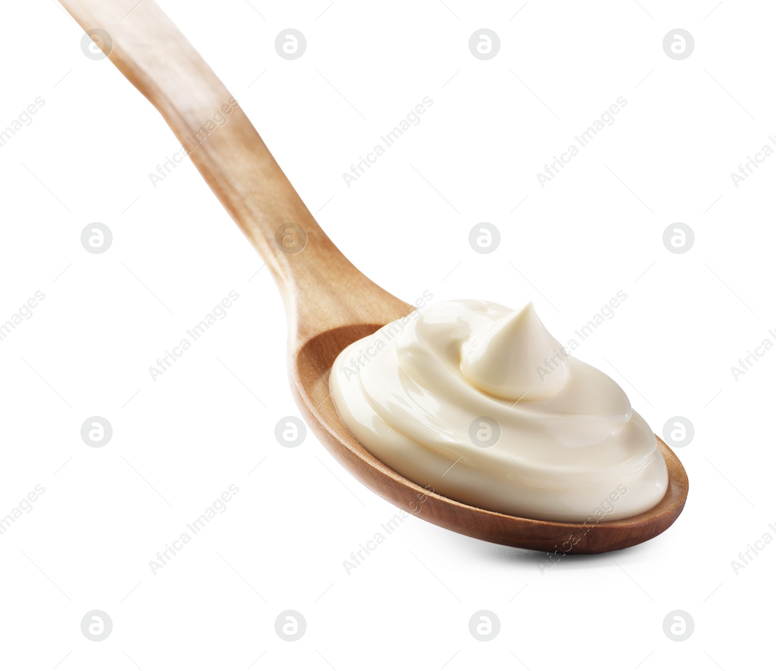 Photo of Natural yogurt in wooden spoon isolated on white