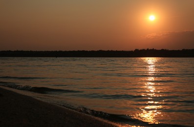 Photo of Landscape with beautiful sunset over calm river