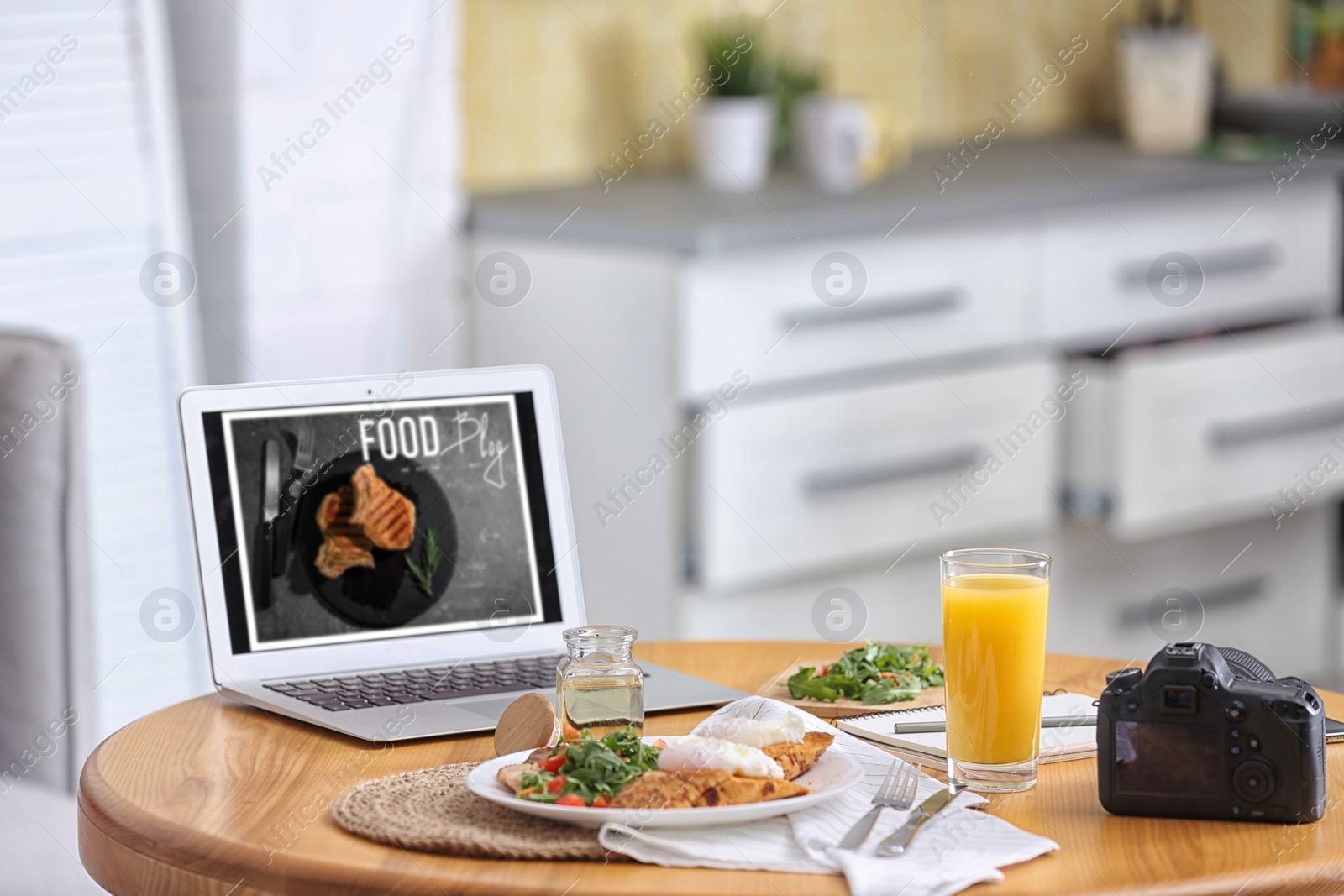 Photo of Delicious lunch served on table with laptop. Food blog