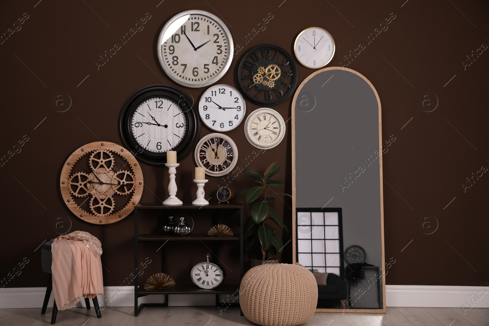 Photo of Stylish room interior with collection of wall clocks