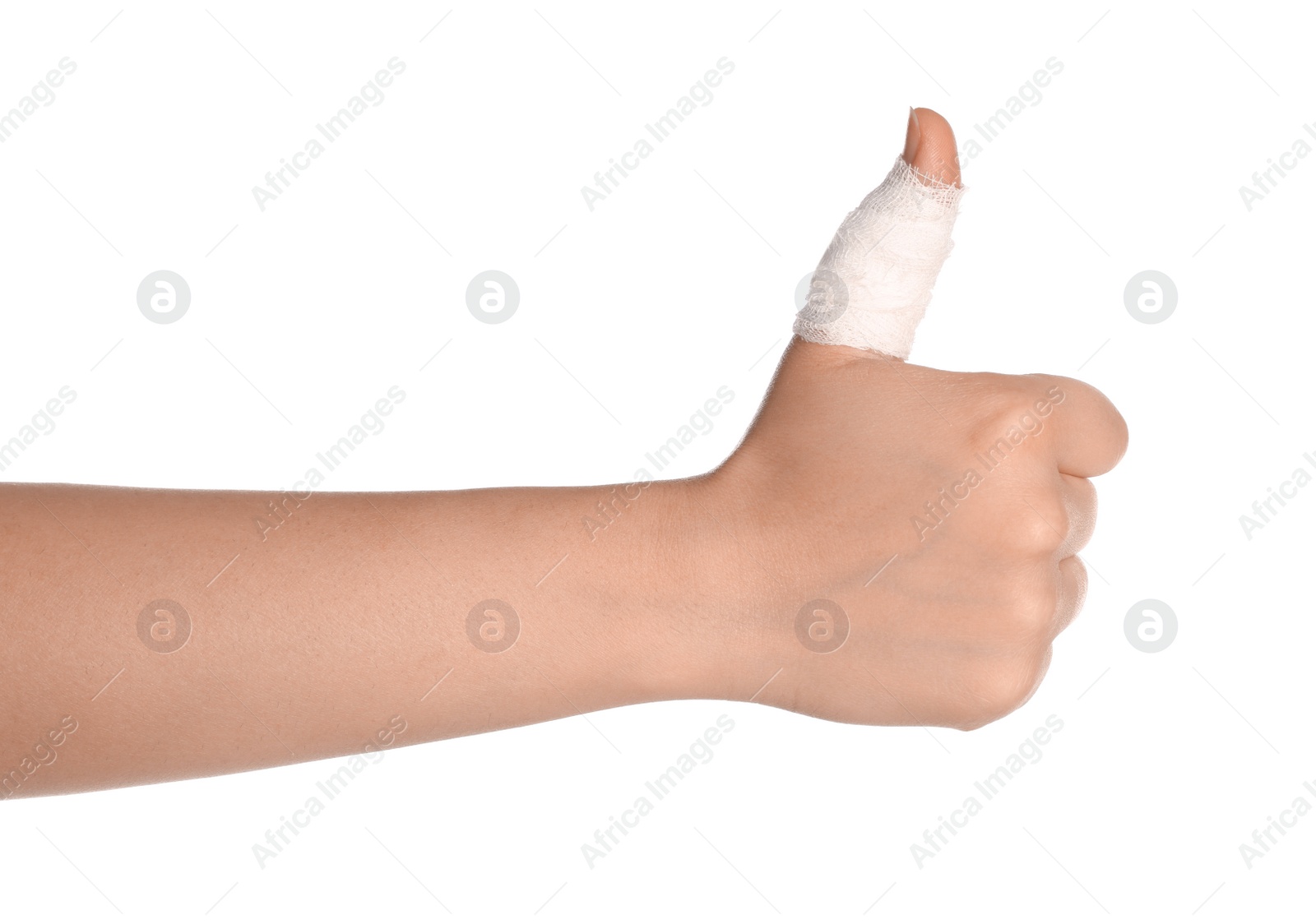 Photo of Woman showing thumb up wrapped in medical bandage on white background, closeup