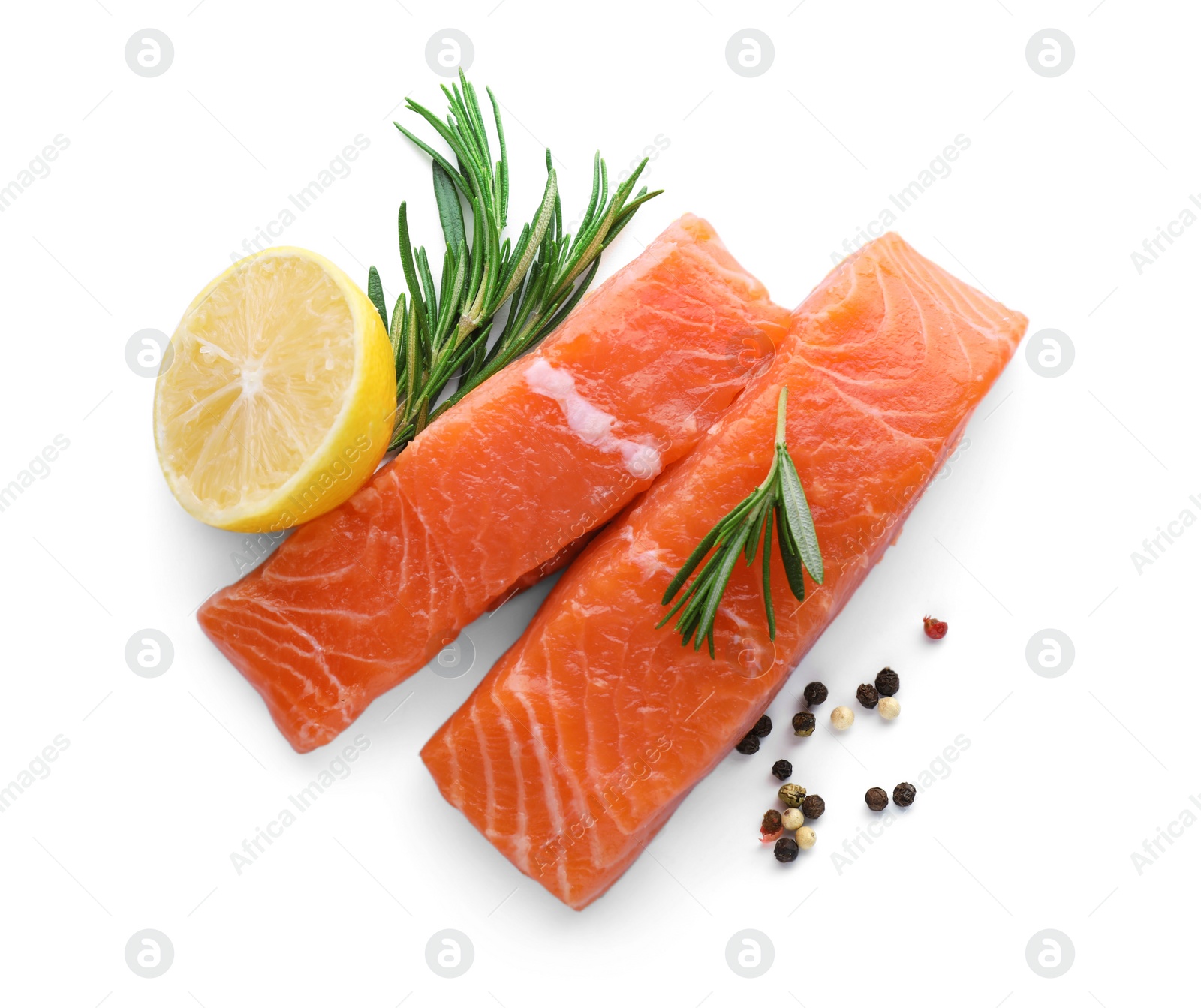 Photo of Pieces of fresh raw salmon, spices and lemon on white background, top view