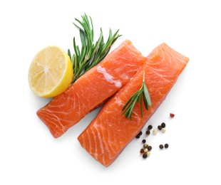 Pieces of fresh raw salmon, spices and lemon on white background, top view