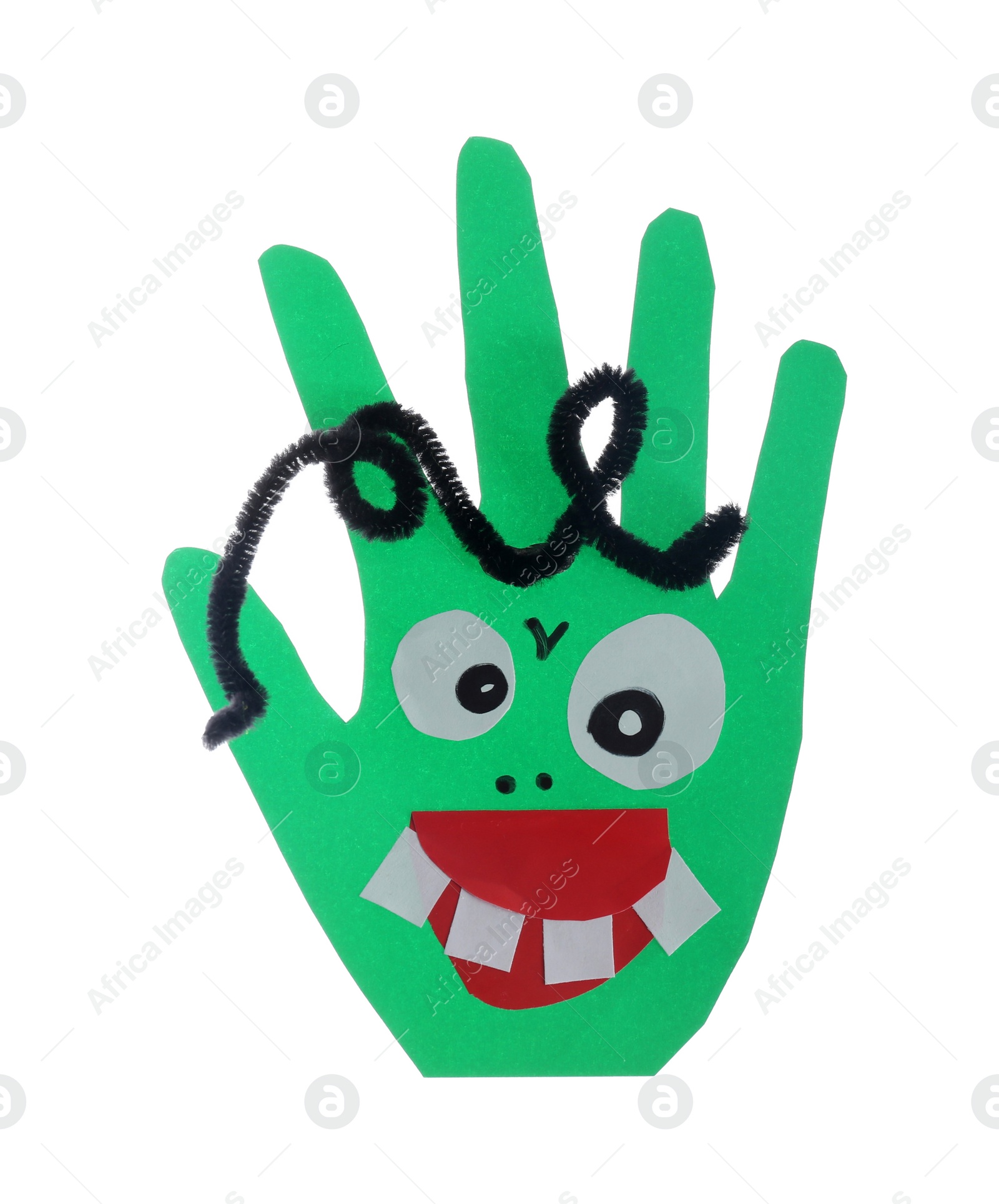 Photo of Funny green hand shaped monster isolated on white, top view. Halloween decoration