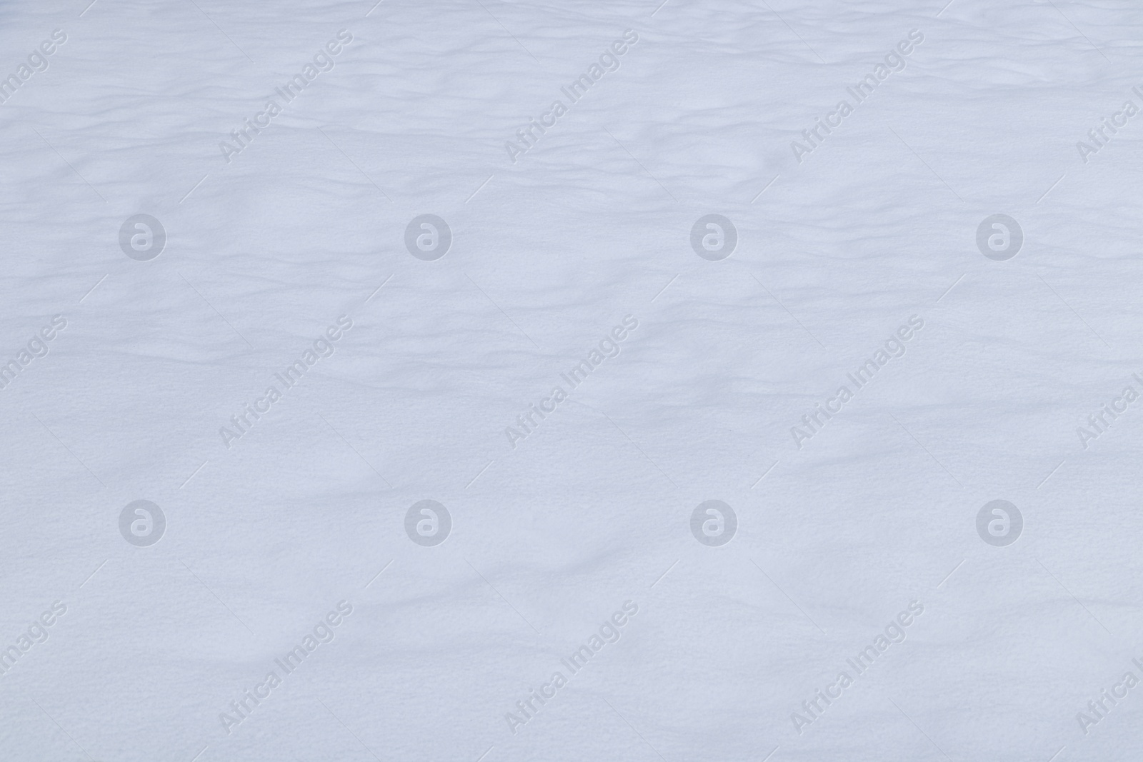 Photo of Beautiful shiny snow as background, closeup view