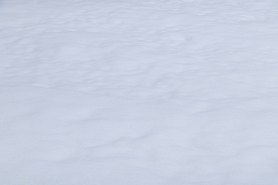 Photo of Beautiful shiny snow as background, closeup view