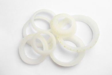 Photo of Fresh raw onion rings on white background