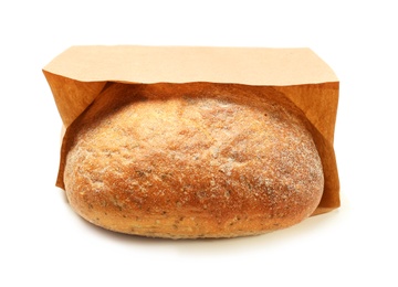 Photo of Paper bag with bread on white background