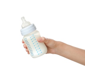 Woman holding baby bottle with milk on white background