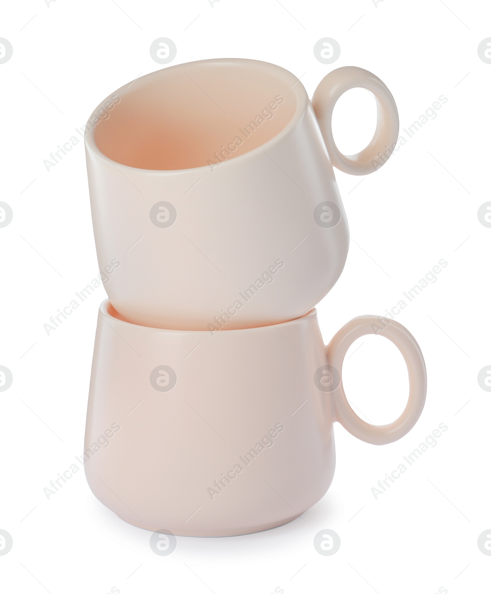 Photo of New clean ceramic cups on white background