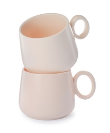 Photo of New clean ceramic cups on white background