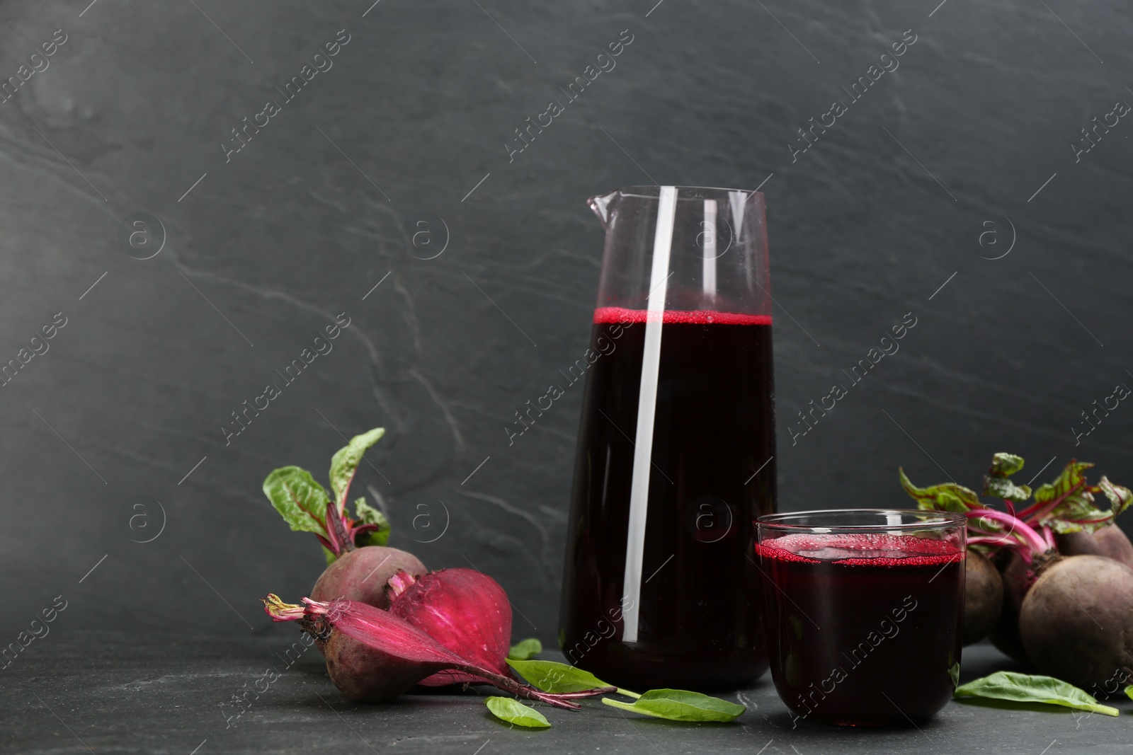 Photo of Freshly made beet juice on black table