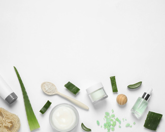 Photo of Flat lay composition with aloe vera and cosmetic products on white background
