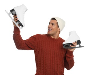 Emotional man with ice skates on white background