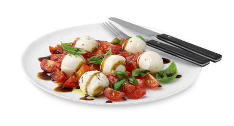 Photo of Tasty salad Caprese with tomatoes, mozzarella balls, basil and cutlery on white background