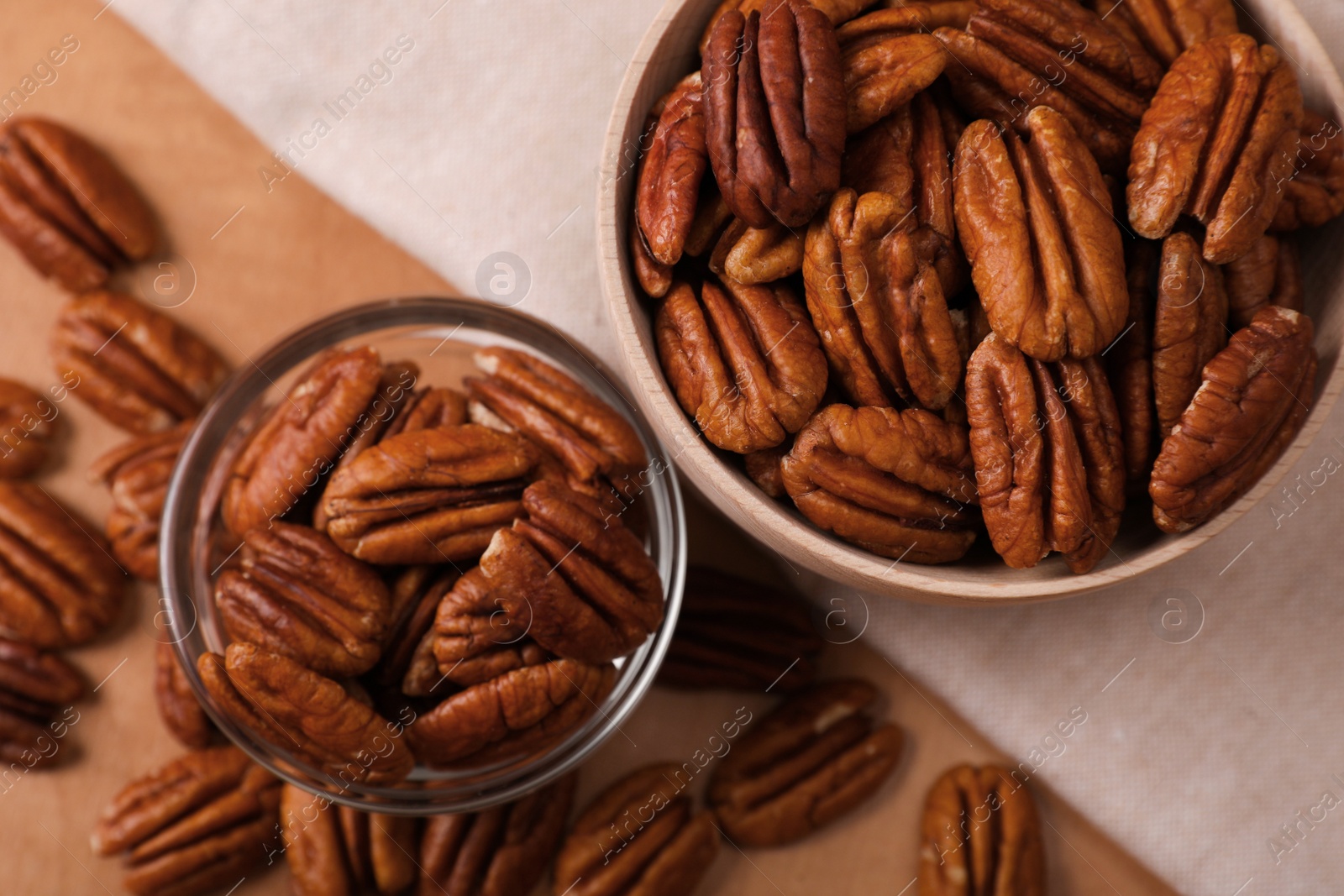 Photo of Flat lay composition with tasty pecan nuts on wooden table