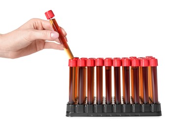 Woman taking test tube with brown liquid from stand on white background, closeup