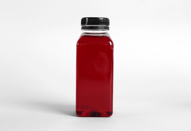 Photo of Bottle with delicious fresh juice on light background