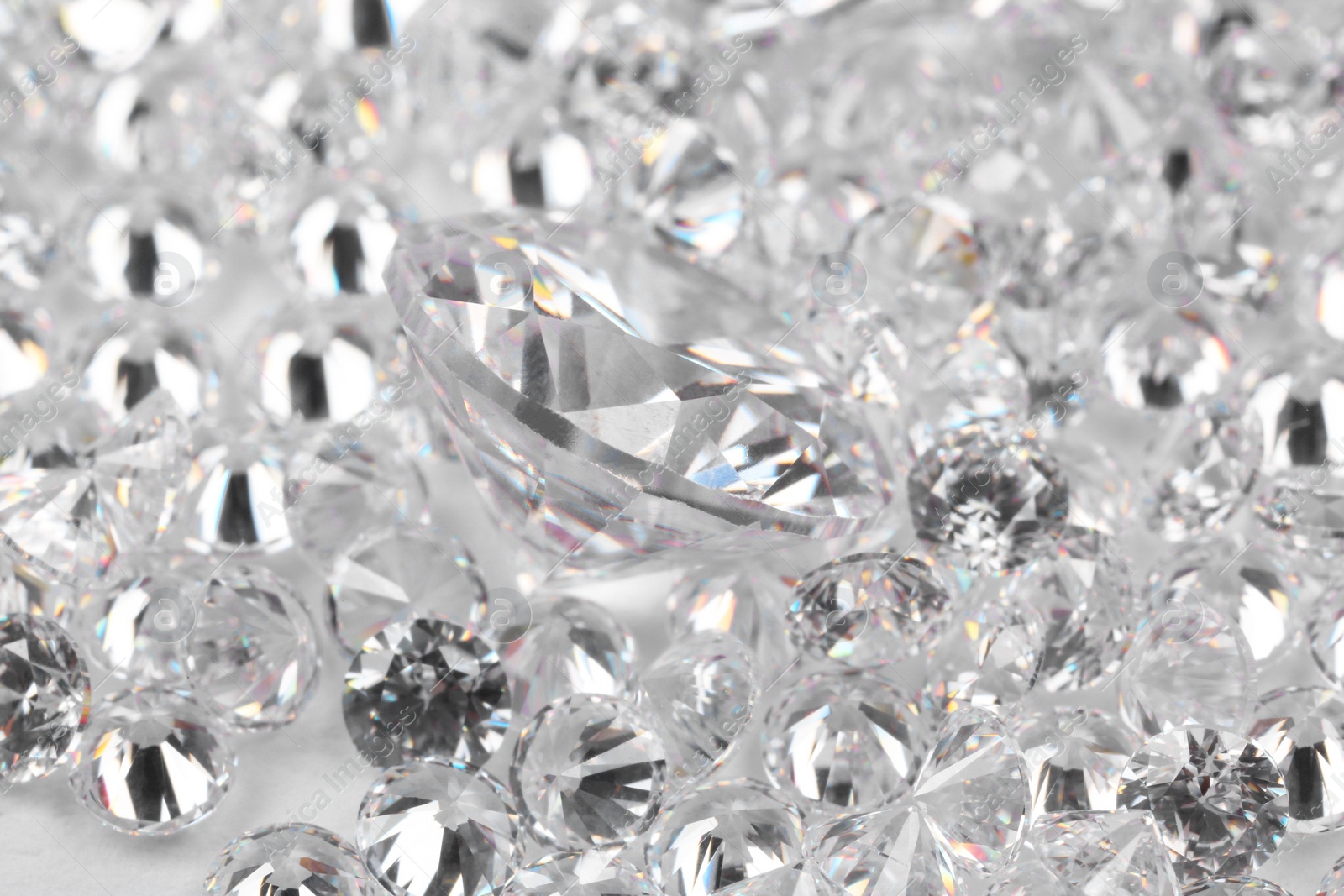 Photo of Many beautiful shiny diamonds as background, closeup