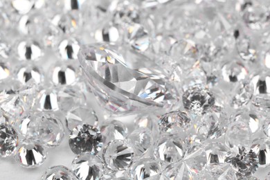 Photo of Many beautiful shiny diamonds as background, closeup