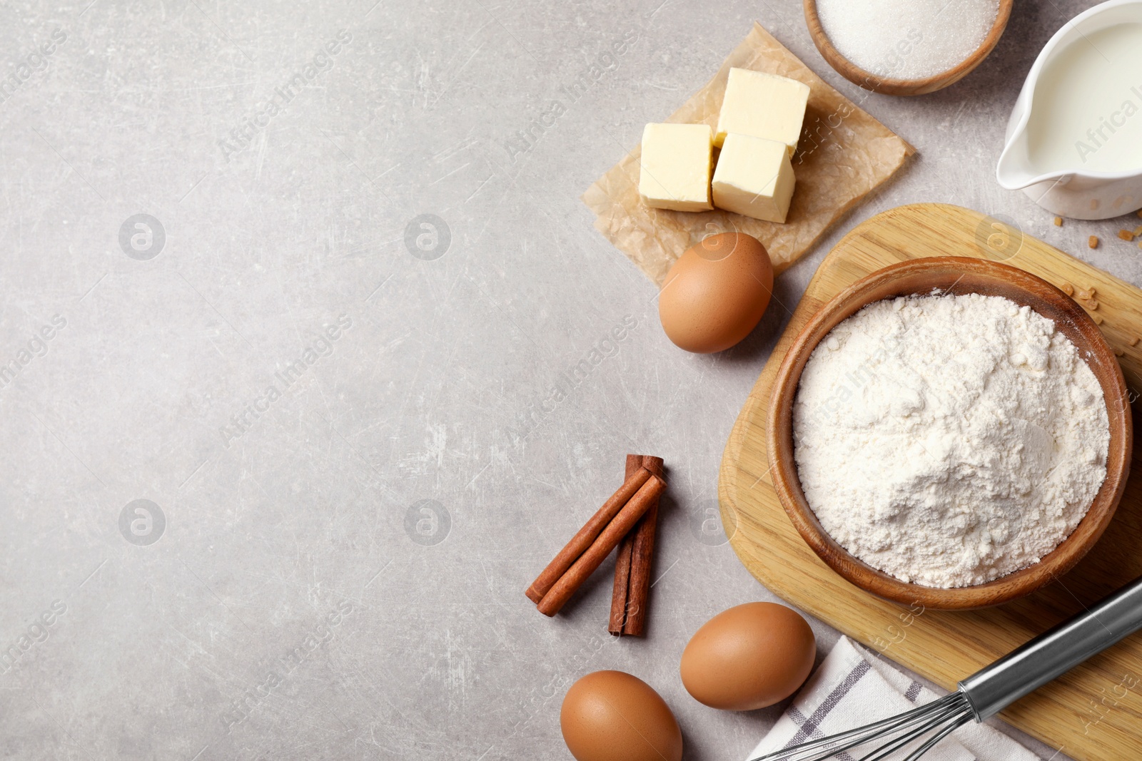 Photo of Flat lay composition with fresh ingredients for delicious homemade cake on light grey marble table. Space for text