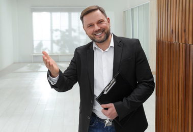 Male real estate agent showing new apartment