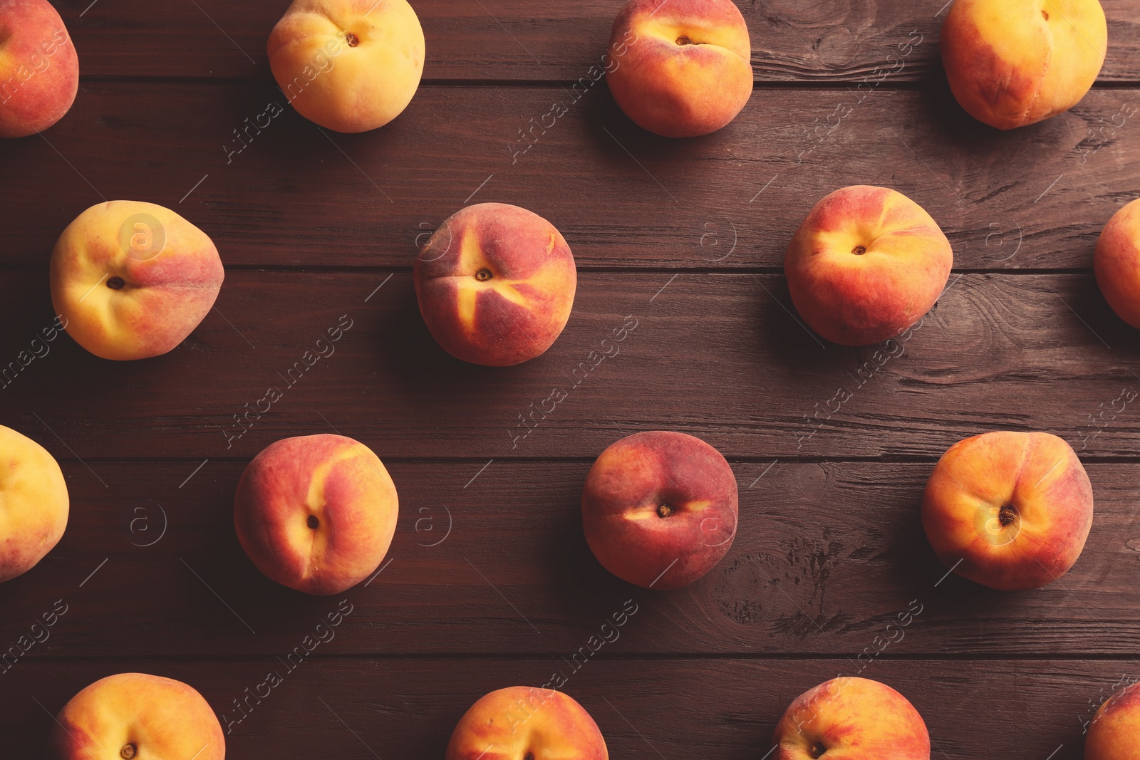 Photo of Fresh sweet peaches on wooden table, flat lay