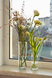 Photo of Different beautiful spring flowers on windowsill indoors